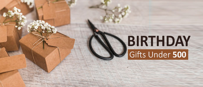 Premium Photo | Different gifts with red ribbon on wood background